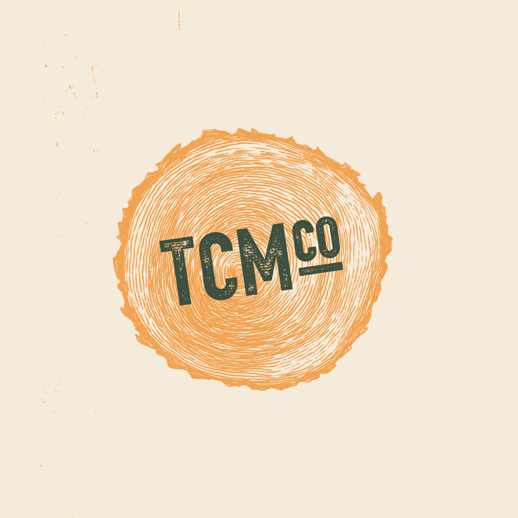 TCM Co logo with tree-ring illustration